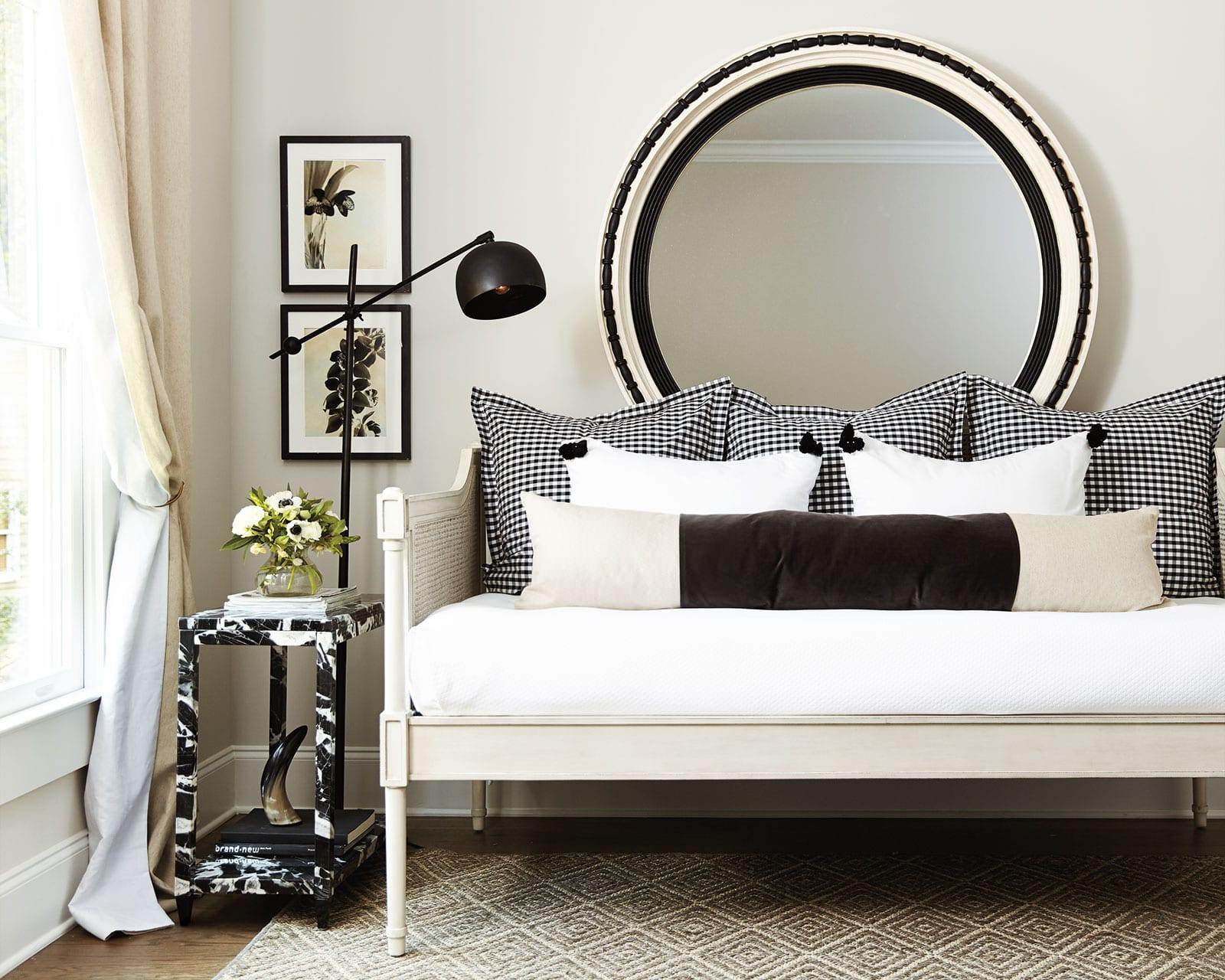 White bedroom with dark wood