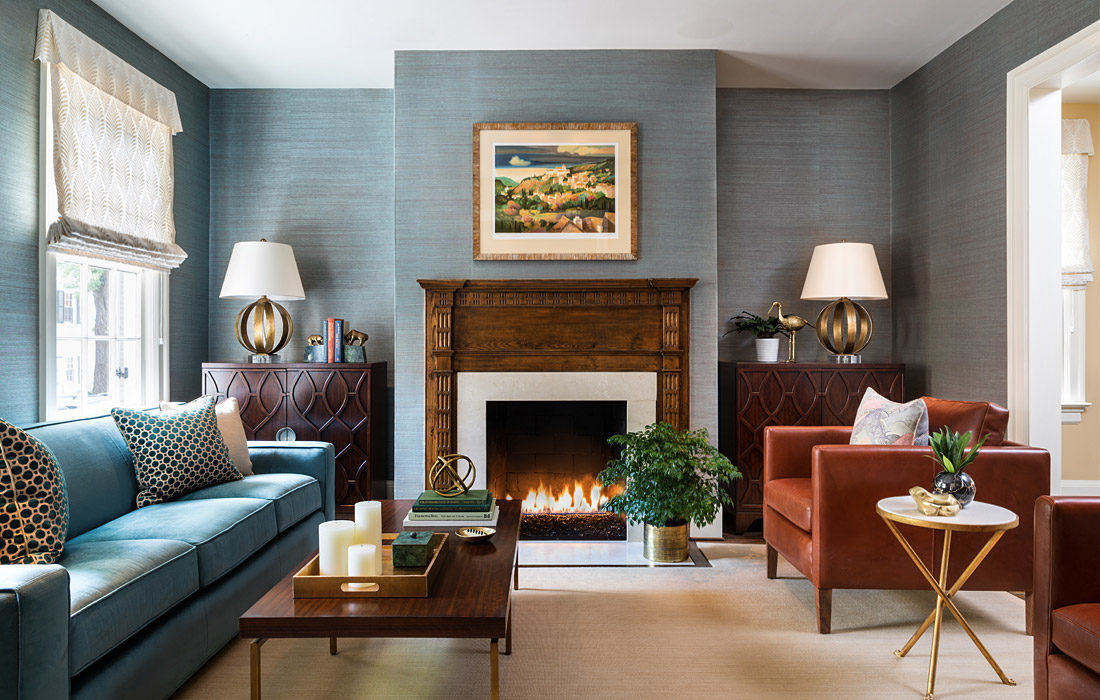 A Porta Romana brass 'Luca' chandelier and a rug by Luke Irwin add bespoke touches to this blue and white colour scheme in a grand London villa decorated by