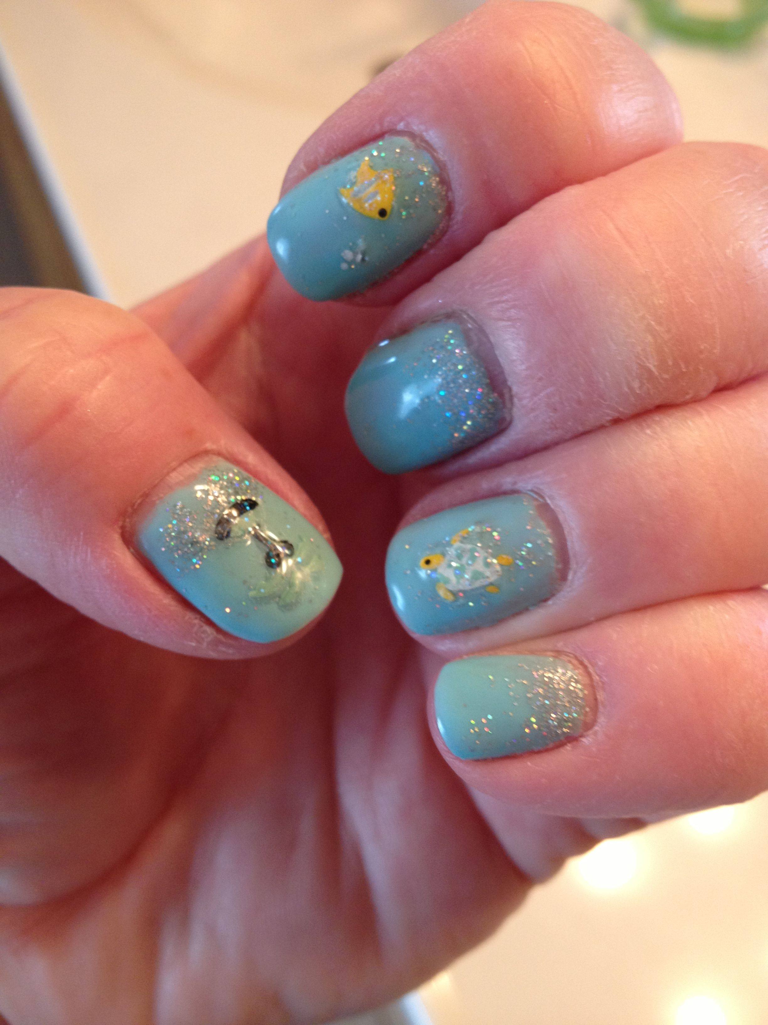 Gel polish with ocean decals and glitter