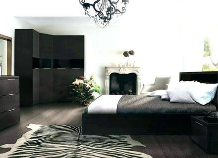 Give your bedroom a modern glam feel by decorating with a black and white color scheme