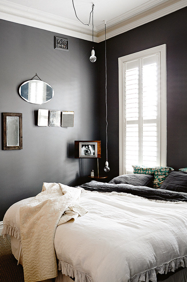 The glossy black hardwood flooring of this room is unusual and eye catching beyond compare