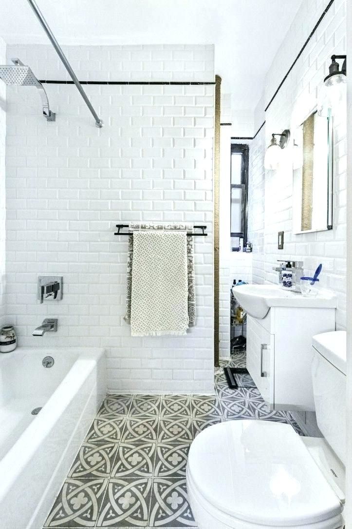 Narrow bathroom benefits from shower window to break up the space and provide fresh air
