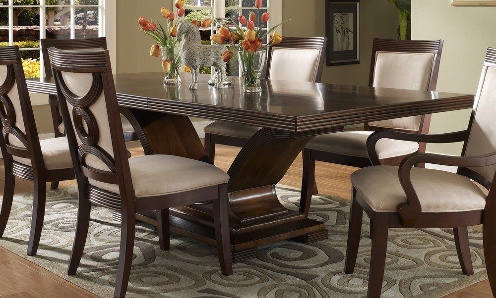 Dining room with dark wood dining table and grey upholstered dining chairs