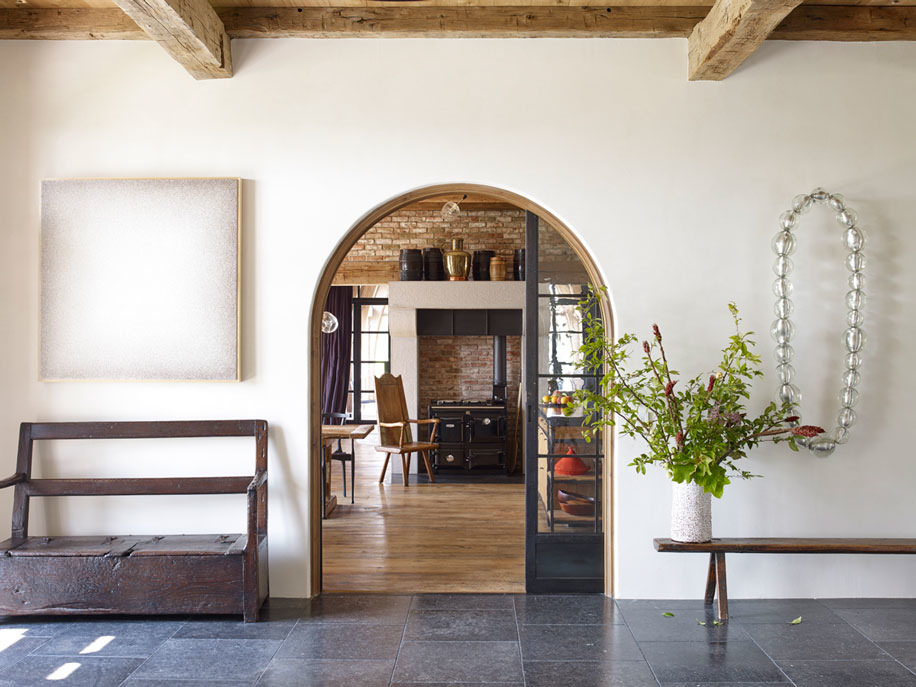 Gorgeous breakfast nook in a kitchen with European inspired design, black and white check floors