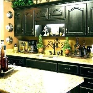 decorating above kitchen cabinets tuscany | Here's a closer look at the top of the cabinets