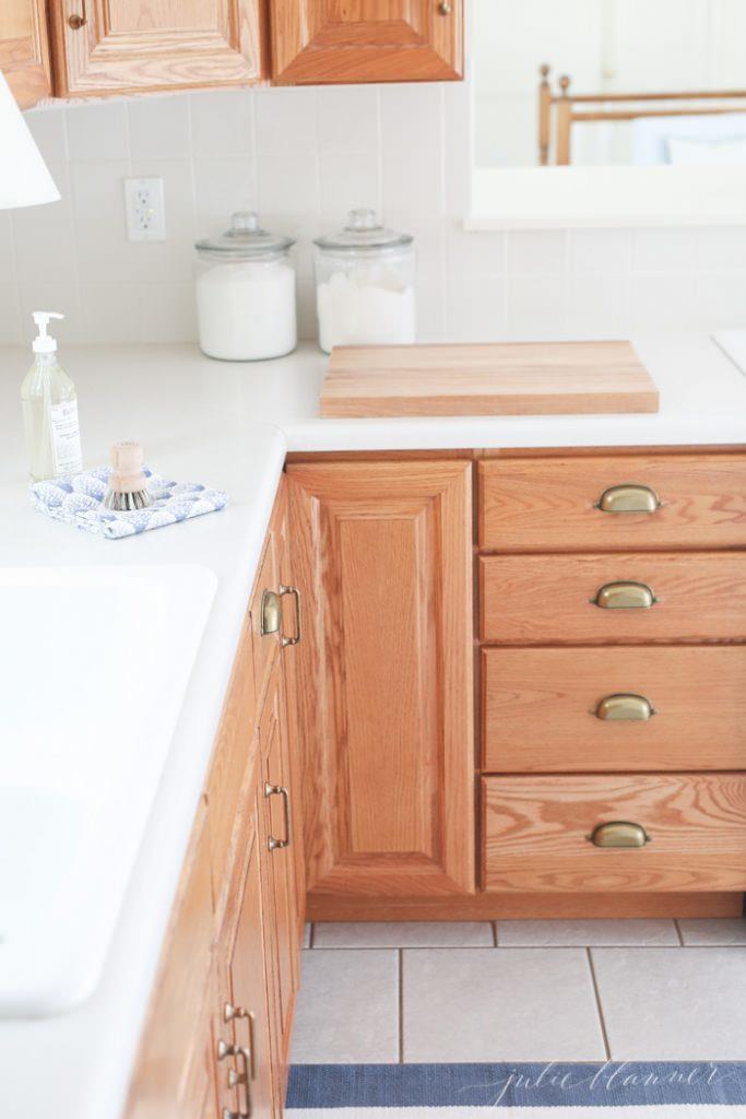 Tips and tricks to update dated oak kitchen cabinets without painting them