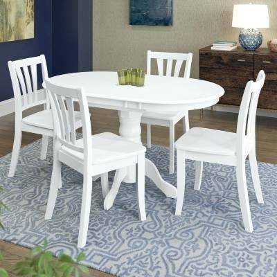 The Coaster Country butcher block white and oak table and chairs in a living room