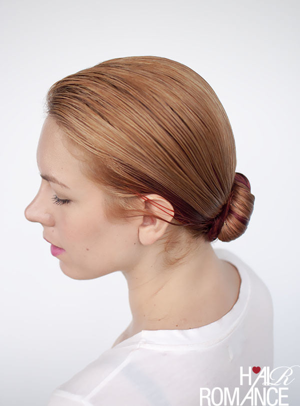 This super messy style features long, thick hair that's piled on top of the head into a loose bun